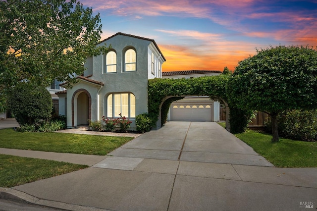 mediterranean / spanish house with a yard