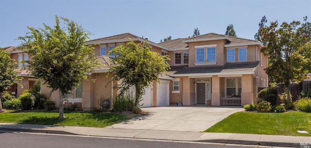 view of front of home featuring a garage and a front yard