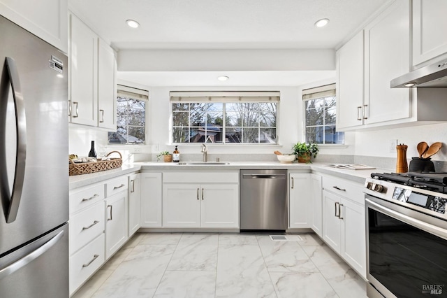 kitchen with white cabinetry, sink, and appliances with stainless steel finishes