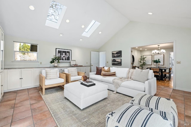 tiled living room with a chandelier and high vaulted ceiling