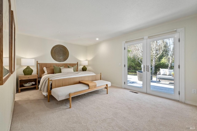 bedroom featuring ornamental molding, access to outside, light colored carpet, and french doors