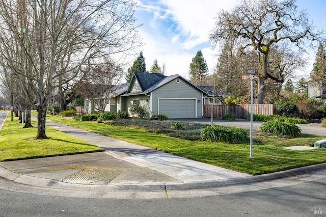 view of front of house featuring a garage and a front yard