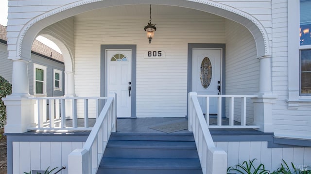 doorway to property featuring a porch