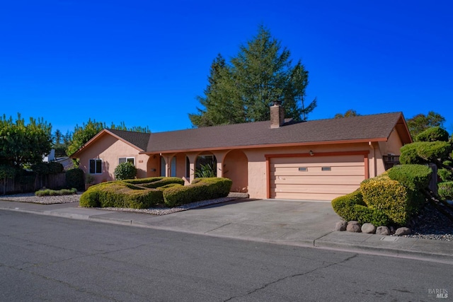 single story home featuring a garage