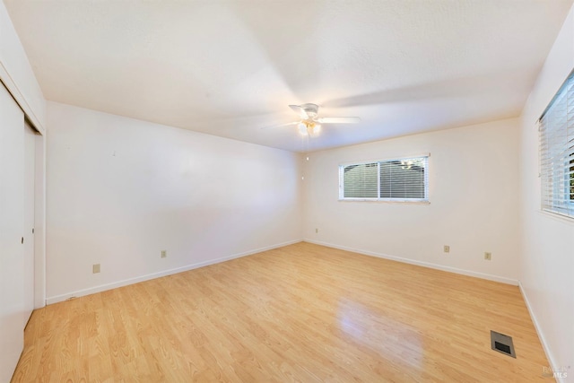 unfurnished room with ceiling fan and light hardwood / wood-style floors