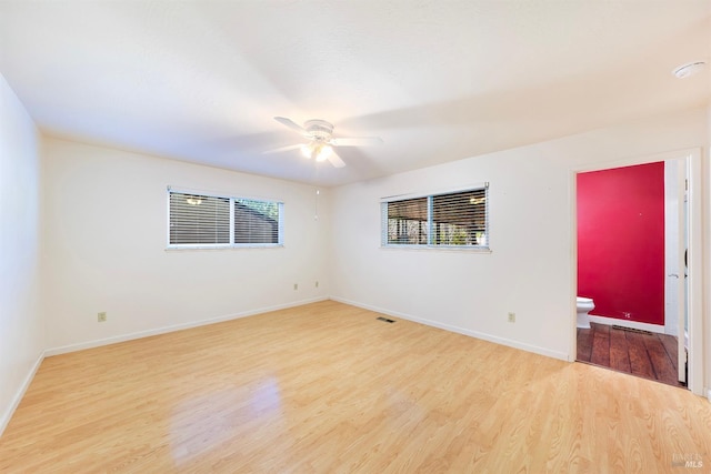 empty room featuring ceiling fan and light hardwood / wood-style floors