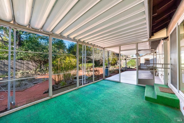 unfurnished sunroom featuring a wealth of natural light