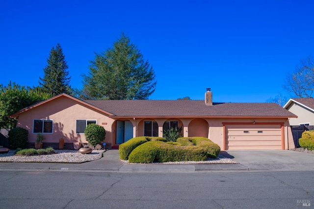 single story home featuring a garage