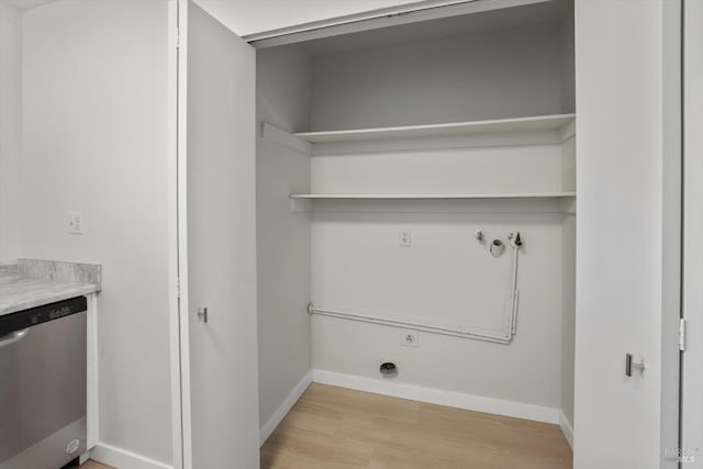 laundry room with light hardwood / wood-style flooring