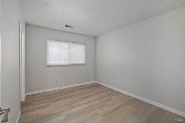 empty room with light wood-type flooring