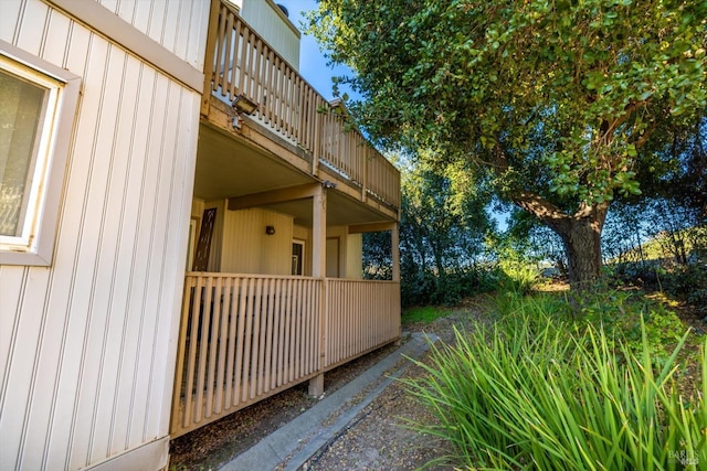 view of side of home featuring a balcony