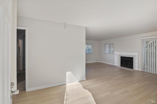 unfurnished living room featuring light wood-type flooring