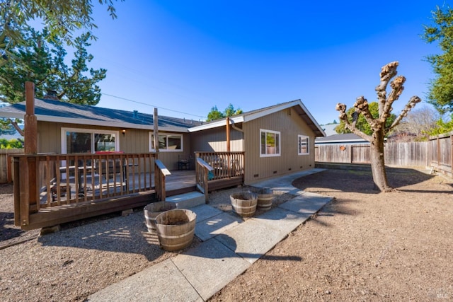 rear view of property with a wooden deck