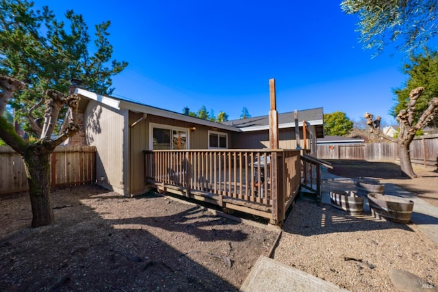 rear view of property with a deck