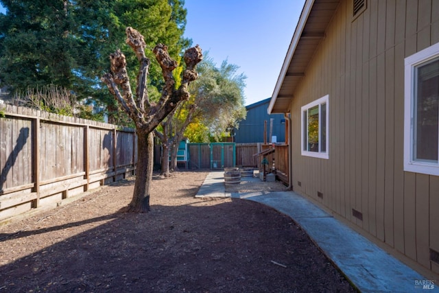 view of yard with an outdoor fire pit