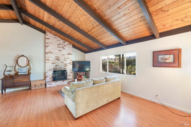 living room with lofted ceiling with beams, a brick fireplace, wooden ceiling, and light wood-type flooring