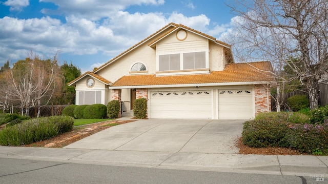 view of front of home featuring a tile roof and driveway