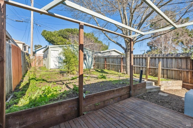 wooden deck featuring a storage unit