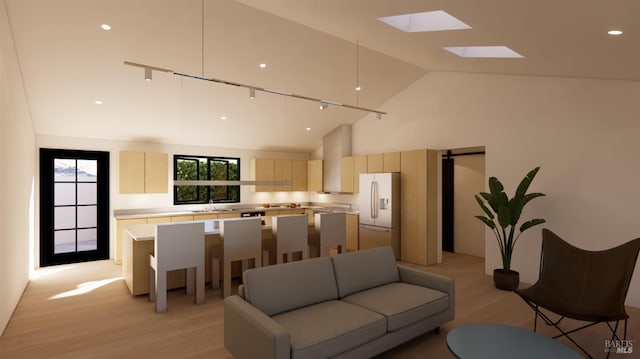 living room featuring light wood finished floors and high vaulted ceiling