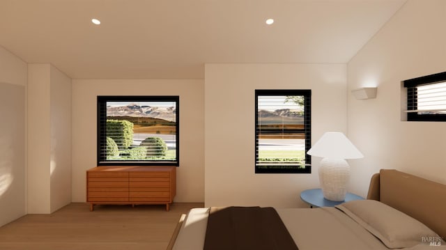 bedroom with recessed lighting and wood finished floors