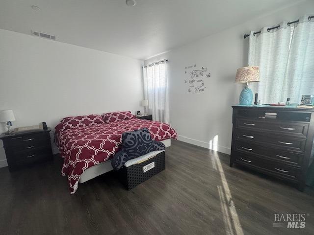 bedroom featuring dark hardwood / wood-style floors