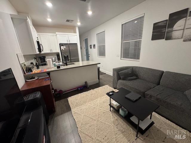 living room featuring dark hardwood / wood-style floors