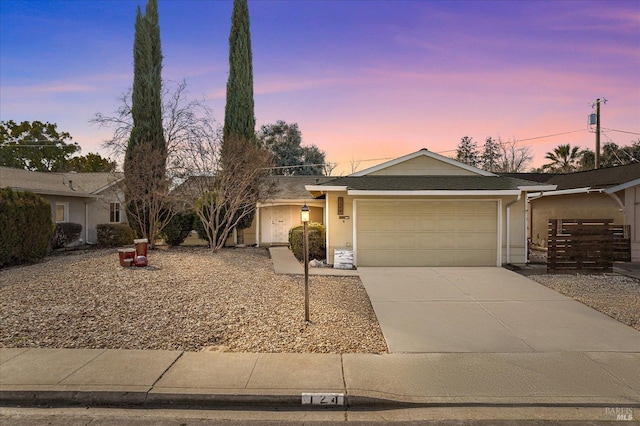 ranch-style home featuring a garage