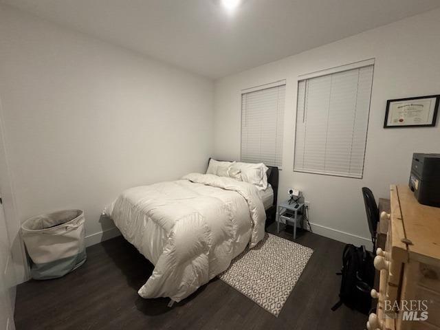 bedroom featuring dark hardwood / wood-style flooring
