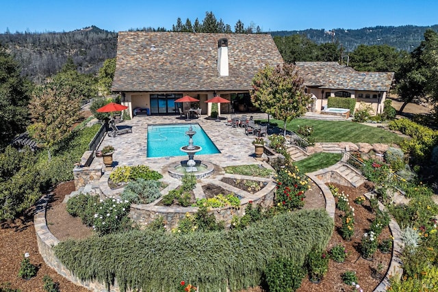 view of pool with a patio area