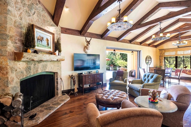 living room featuring a healthy amount of sunlight, dark wood-type flooring, and a chandelier