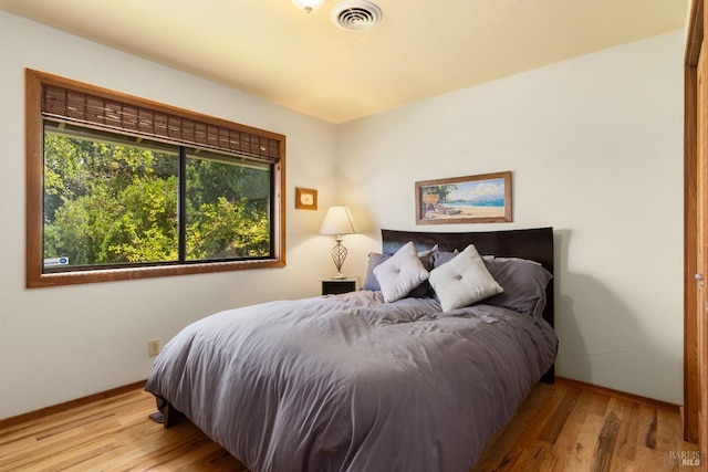 bedroom featuring hardwood / wood-style flooring