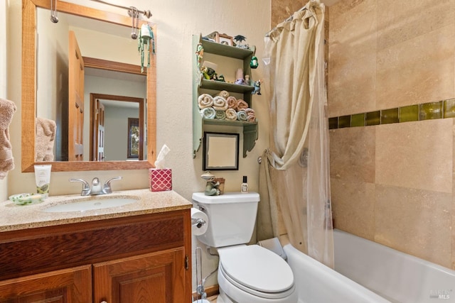 full bathroom with vanity, shower / bath combo with shower curtain, and toilet