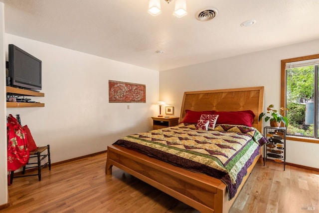 bedroom with light hardwood / wood-style flooring