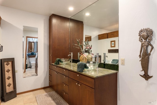 bathroom with vanity and tile patterned flooring