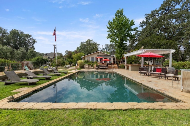 view of swimming pool with a playground, an outbuilding, a pergola, an outdoor living space, and a patio area