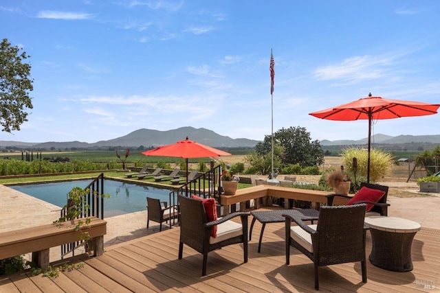 wooden terrace featuring a mountain view