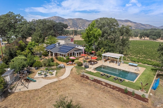 birds eye view of property featuring a mountain view