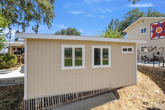 view of property exterior featuring an outdoor structure