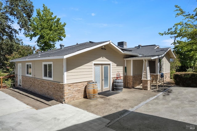 view of front of house featuring central AC unit and a patio