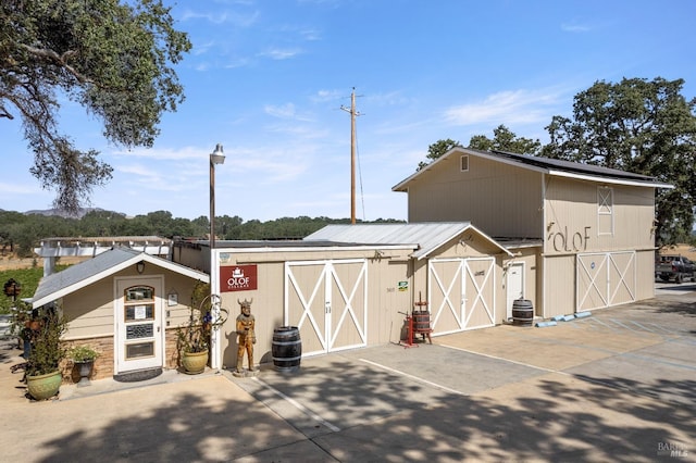 view of outbuilding featuring central air condition unit