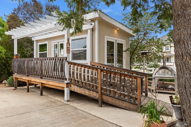 back of house featuring a pergola and a deck