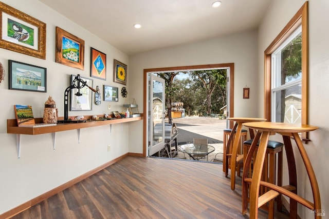 doorway to outside featuring hardwood / wood-style floors and plenty of natural light