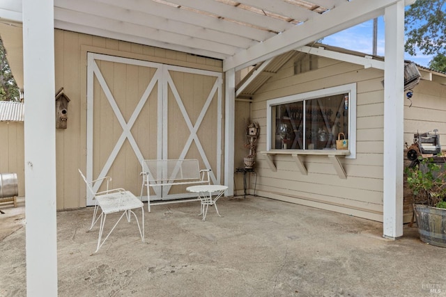 view of patio featuring a pergola