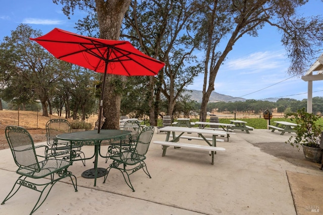 view of patio / terrace with a mountain view