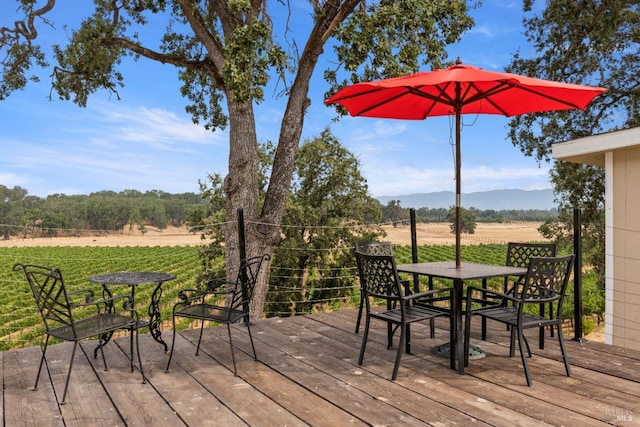 wooden terrace with a mountain view and a rural view