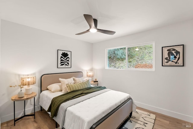 bedroom with ceiling fan and light wood-type flooring