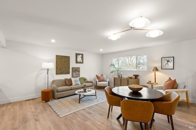 dining room with light hardwood / wood-style flooring