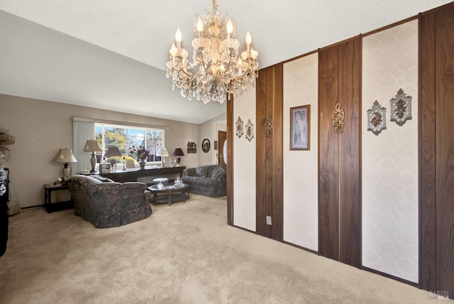 carpeted living room with lofted ceiling and a chandelier