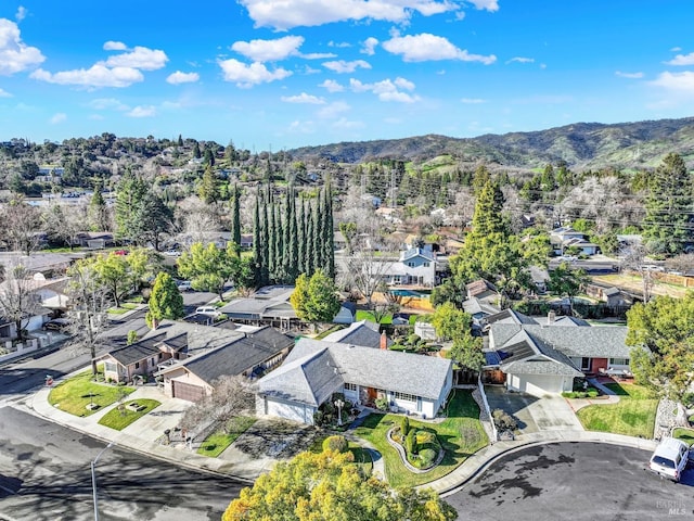 drone / aerial view featuring a mountain view and a residential view