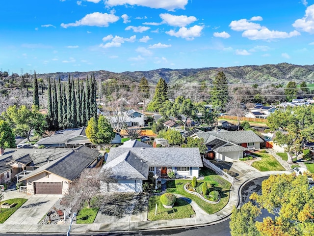 drone / aerial view with a mountain view and a residential view